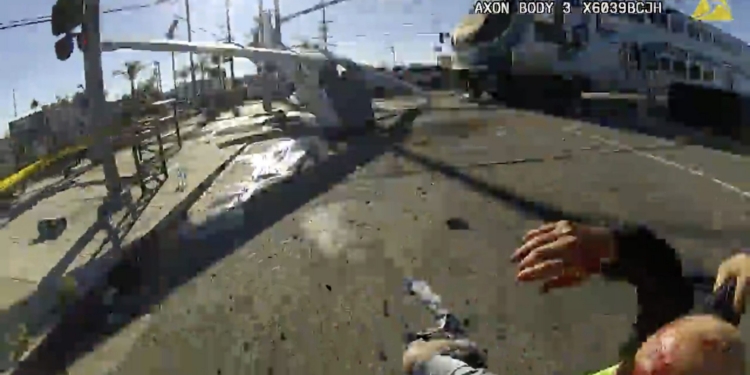 LAPD rescues a man from a plane before a train runs over it.