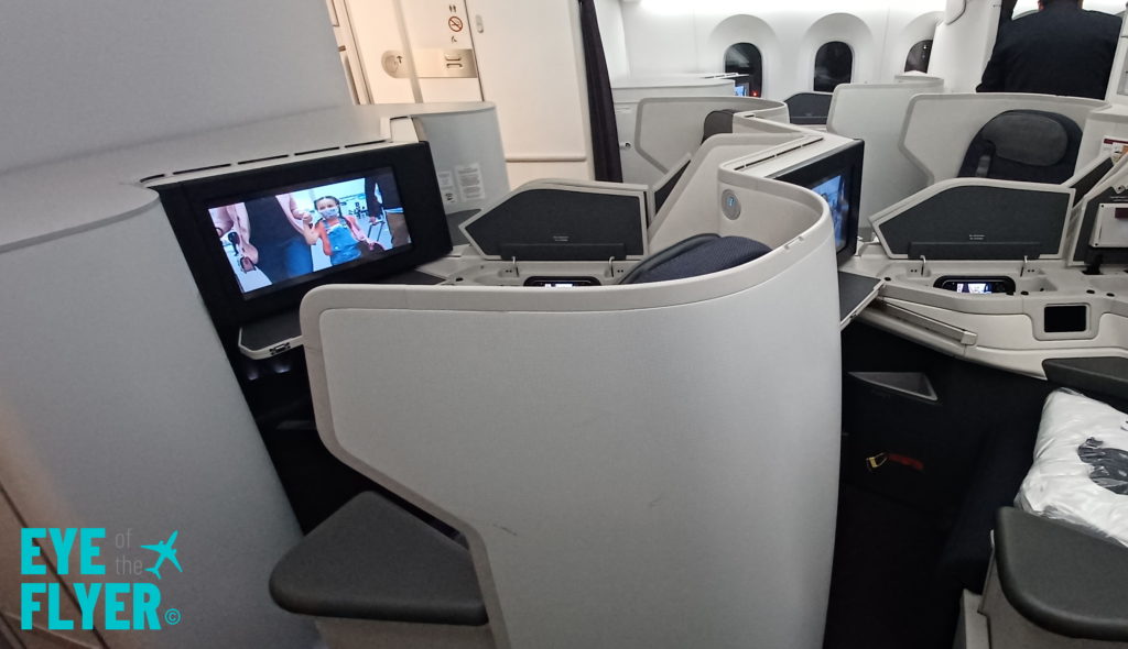 a group of monitors on an airplane