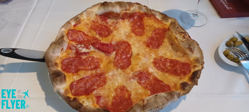 a pepperoni pizza on a plate