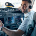 Airline pilot posing in cockpit
