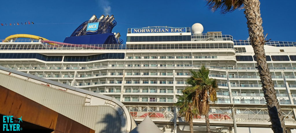 a large cruise ship with palm trees
