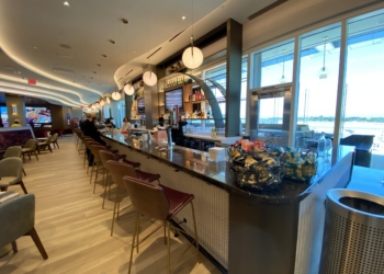 a bar with chairs and a counter