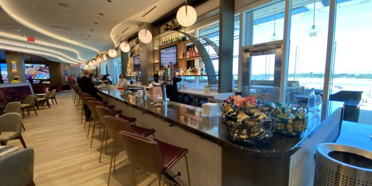 a bar with chairs and a counter