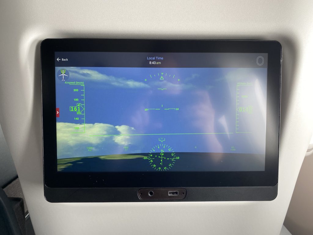 a tablet with a screen showing a plane flight