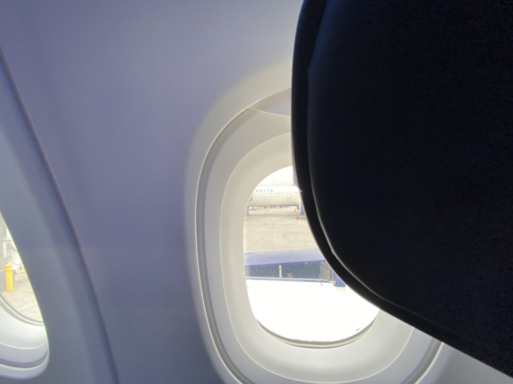 Laptop and tablet storage cubby in the Obstructed window views in Delta Air Lines' Airbus A321neo First Class 