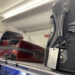 luggage on a shelf in an airplane