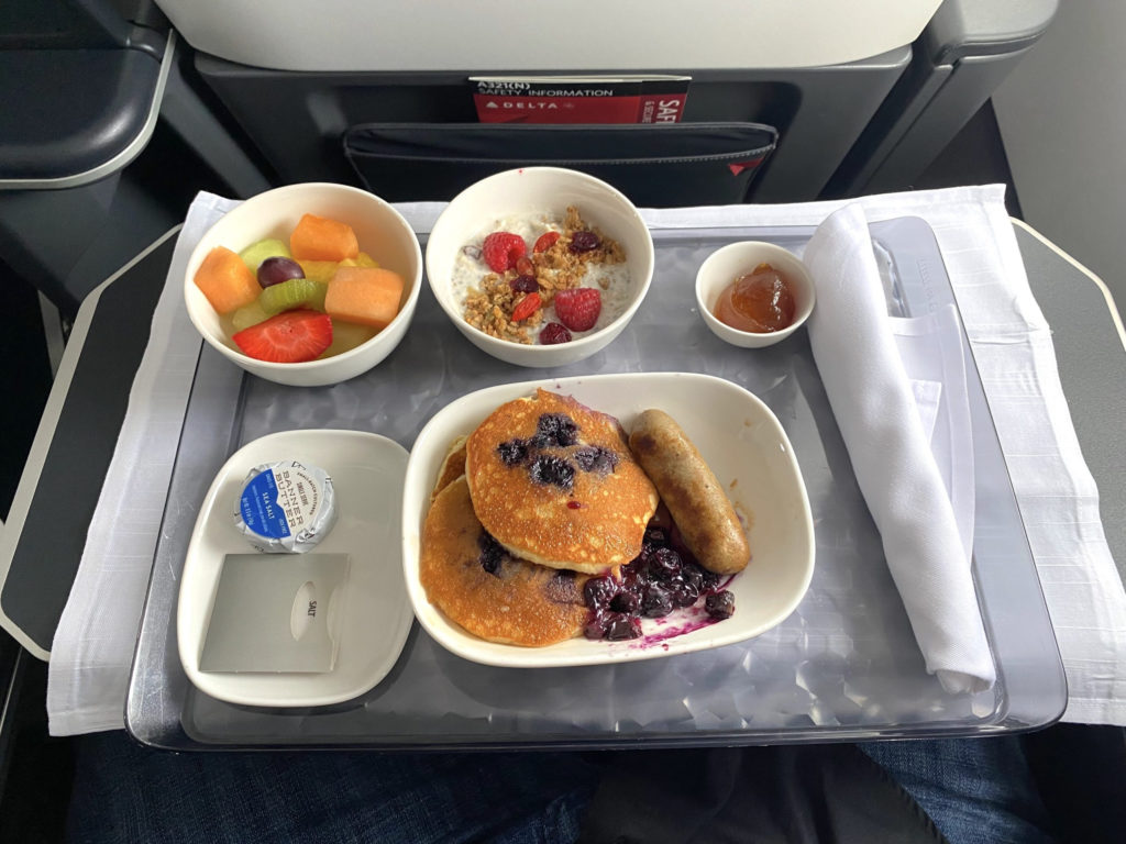 The blueberry pancakes breakfast served in First Class during a Delta Air Lines flight.
