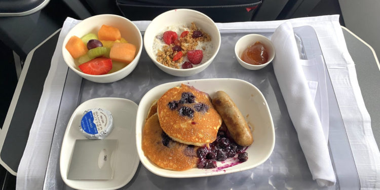 The blueberry pancakes breakfast served in First Class during a Delta Air Lines flight.
