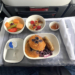 The blueberry pancakes breakfast served in First Class during a Delta Air Lines flight.