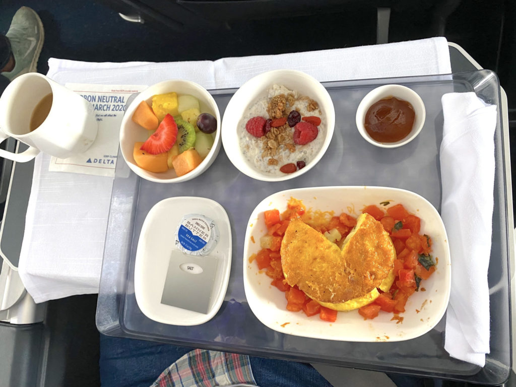 Delta Air Lines' Free Range Egg Tortilla breakfast in First Class:  with potato and sauteed tomato concasse with basil and olive oil