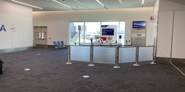 a room with a counter and chairs