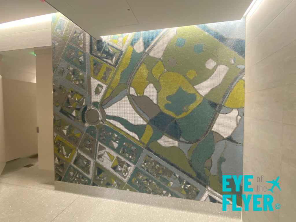 a mosaic wall with a map on it