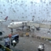 A Delta Air Lines 767-400 experiences bad weather at New York-Kennedy Airport (JFK): thunderstorms and rain.
