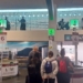 people standing in a line at an airport