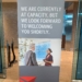 A Delta Sky Club airport lounge in Detroit displays a sign telling guests that the location is at capacity.