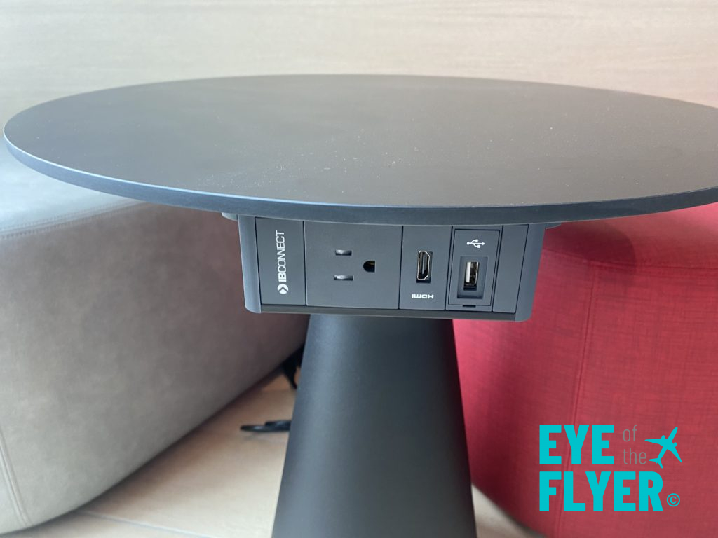 a black round table with usb ports