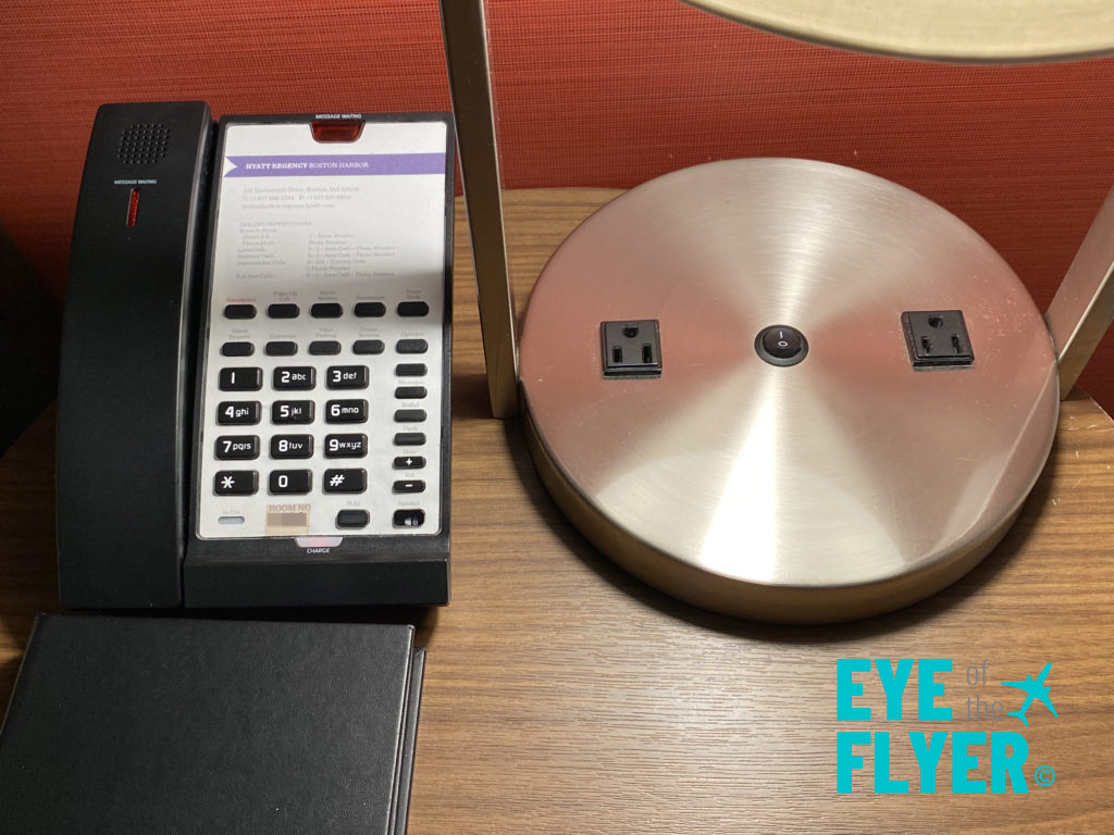 A desk phone and lamp are seen inside a king bedroom at the Hyatt Regency Boston Harbor airport hotel in Boston, Massachusetts.