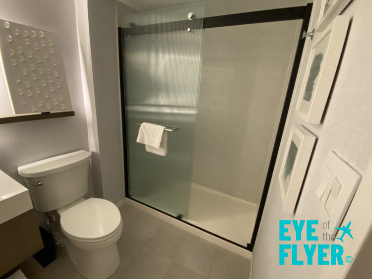 A shower and toilet are seen in the bathroom of a king bedroom at the Hyatt Regency Boston Harbor airport hotel in Boston, Massachusetts.