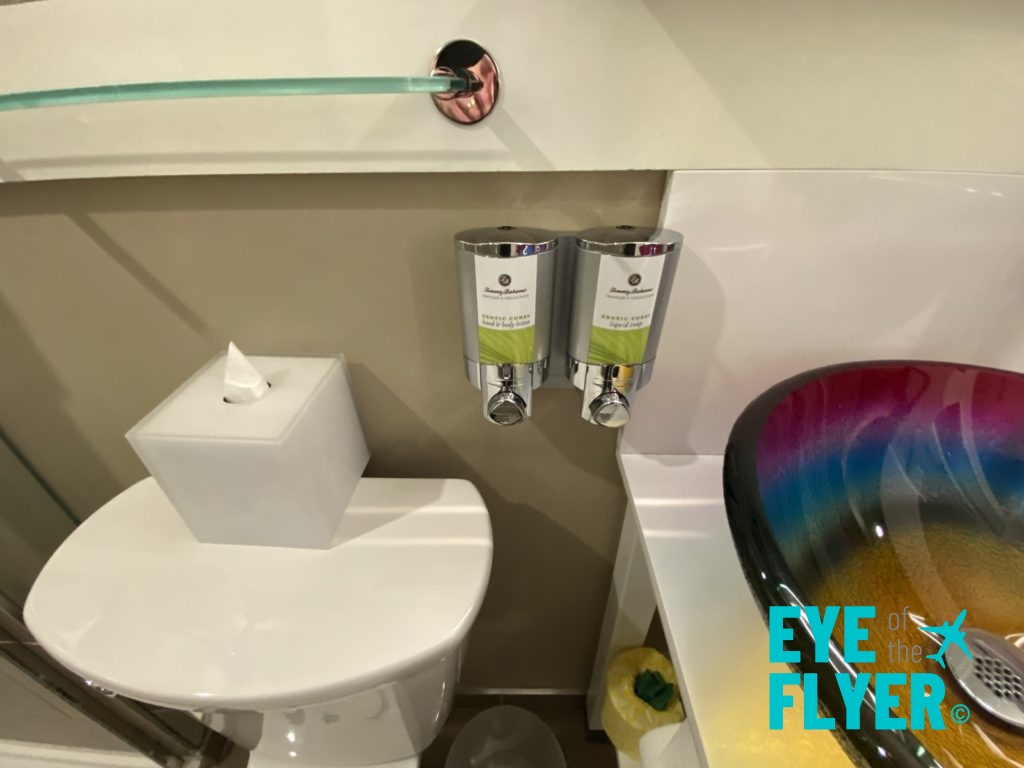 a bathroom with a colorful sink and toilet