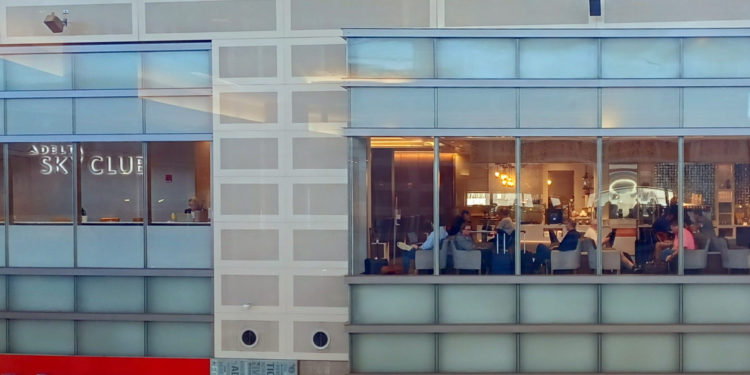 a group of people sitting at tables in a building