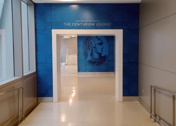 a blue wall with a picture of a man on it