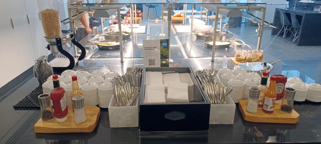 a kitchen counter with silverware and utensils