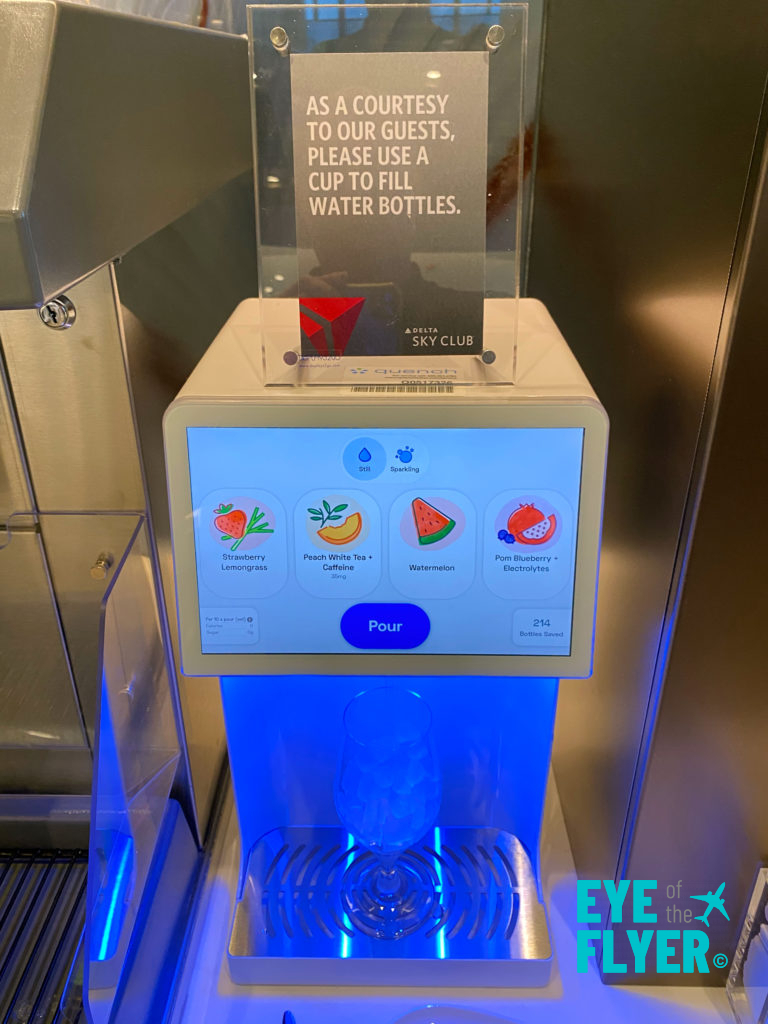 a water dispenser with a screen and a sign