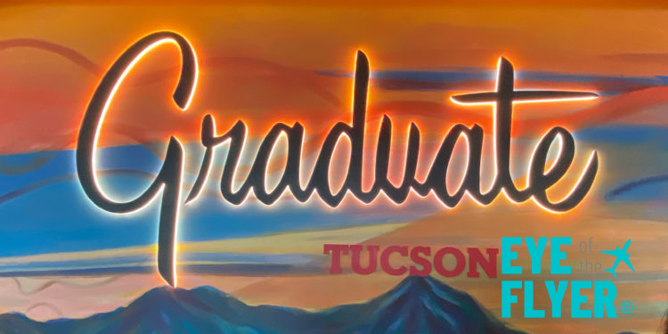 a sign with a picture of mountains and text