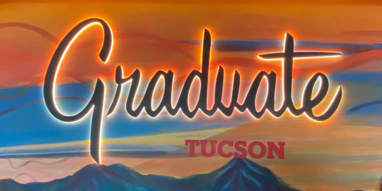a sign with a picture of mountains and text