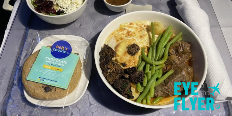 Delta Air Lines First Class meal: port wine demI-glace, potato gratin, sautéed mushrooms, haricot vert, and caramelized onions