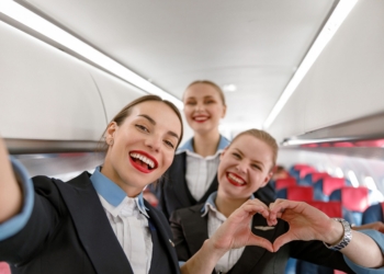 Flight attendants smiling for a selfie photo