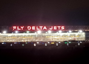 a lit up sign at night
