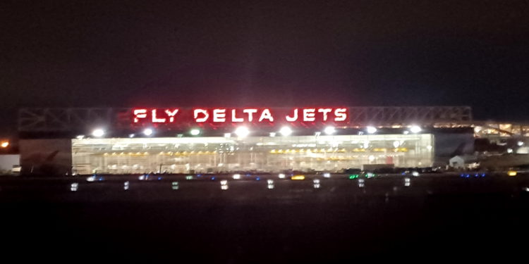 a lit up sign at night