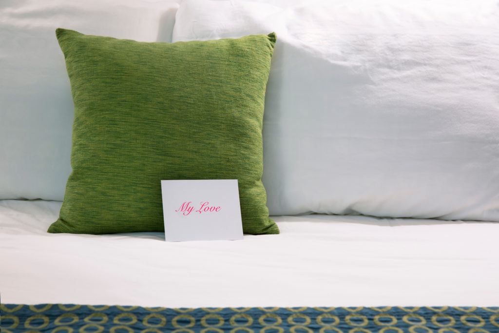 A greeting card on a hotel pillow