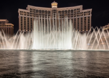 Las Vegas, USA - July 26, 2018: Bellagio Hotel and Casino and Bellagio fountain show as seen at night on July 26, 2018 in Las Vegas, Nevada. Las Vegas is one of the top tourist destinations in the world.