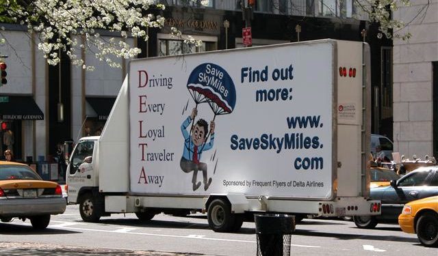 a white truck with a advertisement on the side