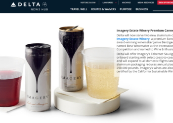 a group of cans and a cup of liquid