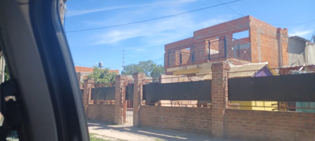 a brick fence and a building