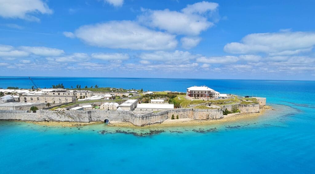 an island with buildings and a body of water