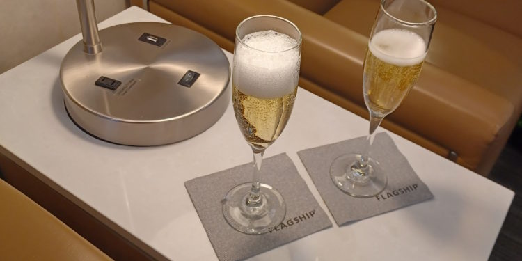 two glasses of champagne on a table