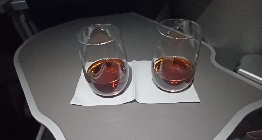 two glasses of liquid on a napkin