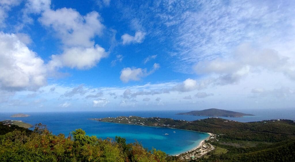 a body of water with a body of water and a city in the distance