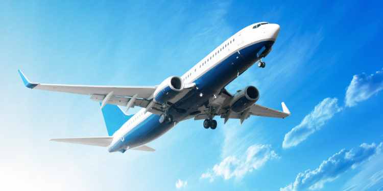 Charter concept - commercial airliner flying in the sky