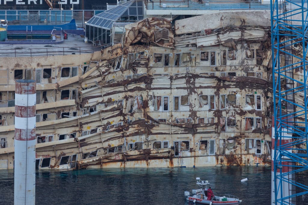 Giglio Island, Italy - October 17, 2013: The damaged area of the wreck of Costa Concordia after Parbuckling, a project that has made possible the rotation of the ship after the sinking in Giglio Island. (Photo: ©iStock.com/nicsimoncini)