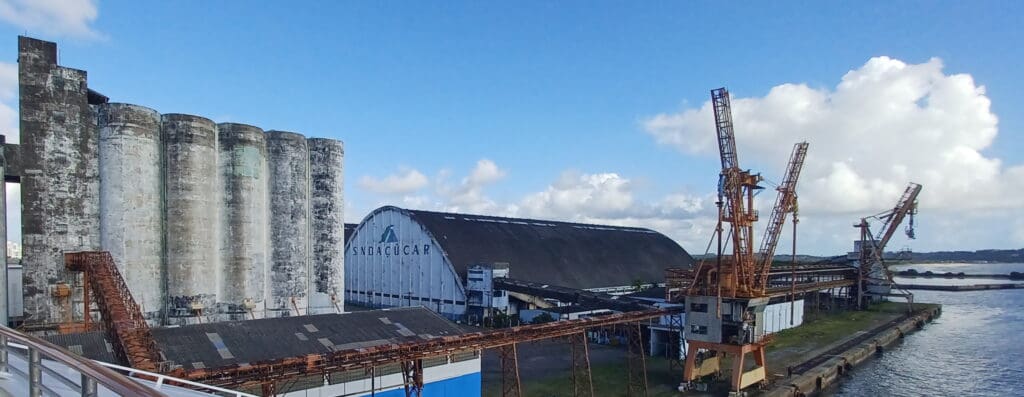 a large building with a silo and a tower