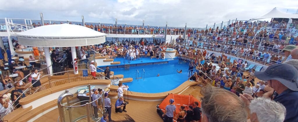 a group of people around a pool