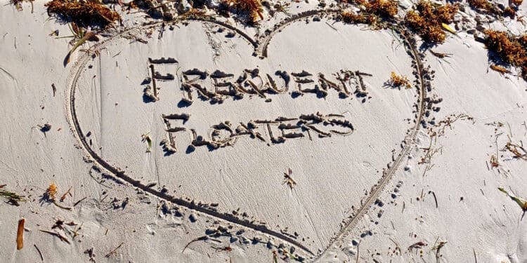 a heart shaped sand with writing on it