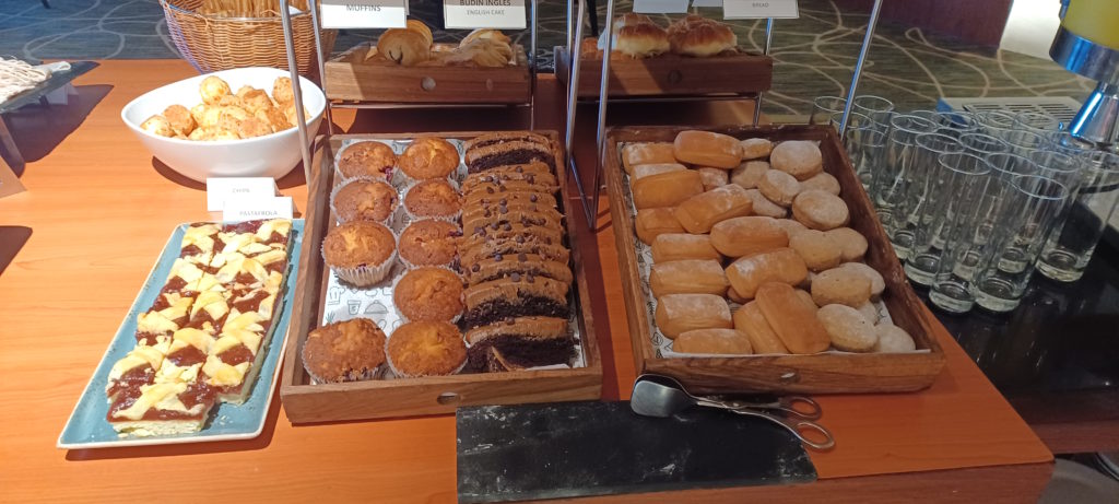 a tray of pastries and muffins