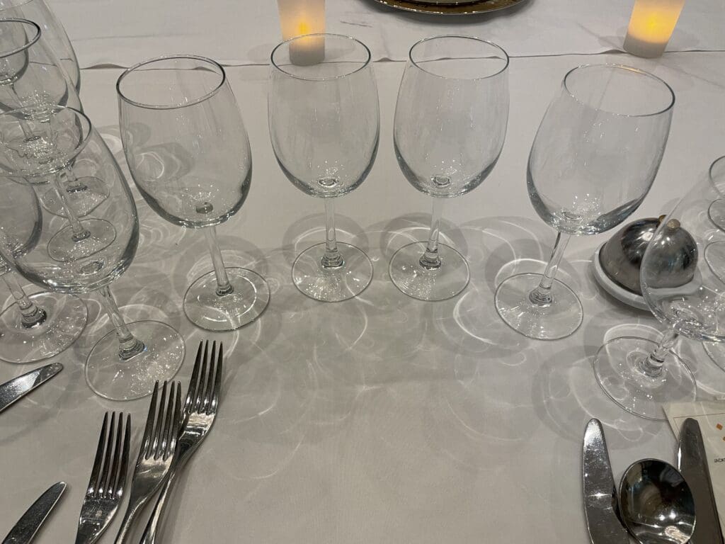 a group of wine glasses on a table