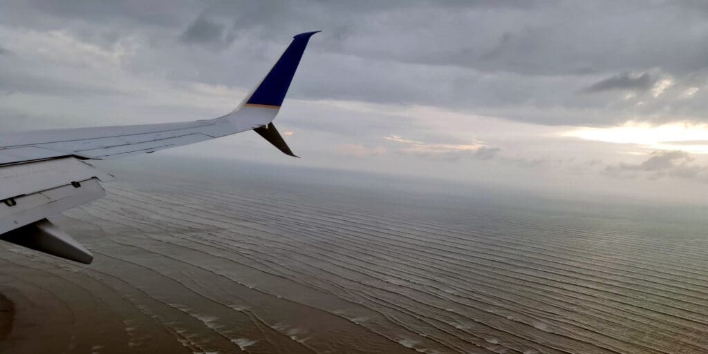 an airplane wing over water